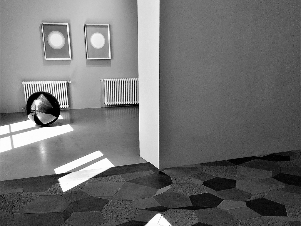 B/w image taken by John Chavers in Reykjavik of Olufur Eliasons Studio showing artwork with geometric tiles and sun spot illuminations